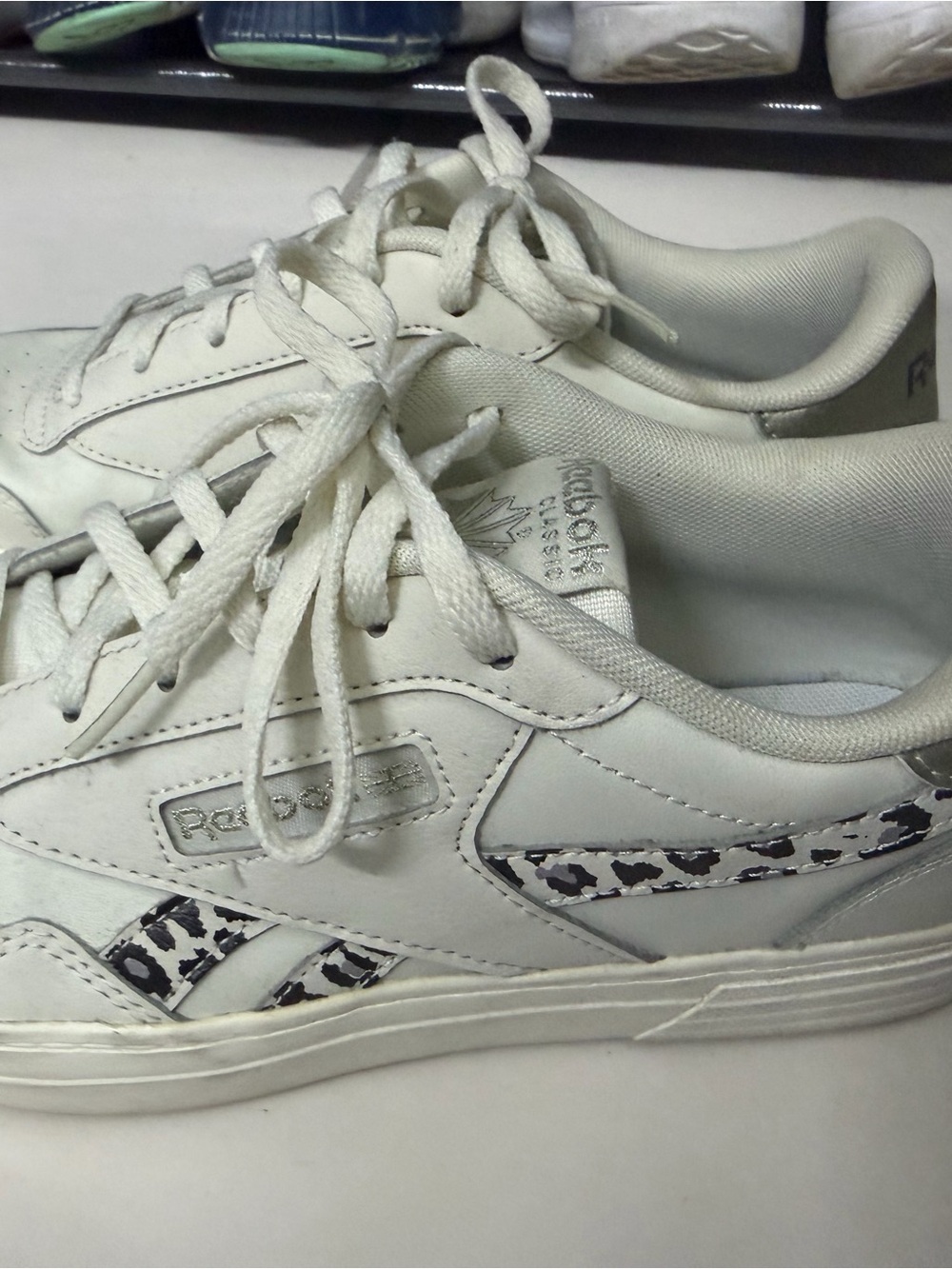 Reebok Women's White Leather Sneakers with Black Leopard Accent